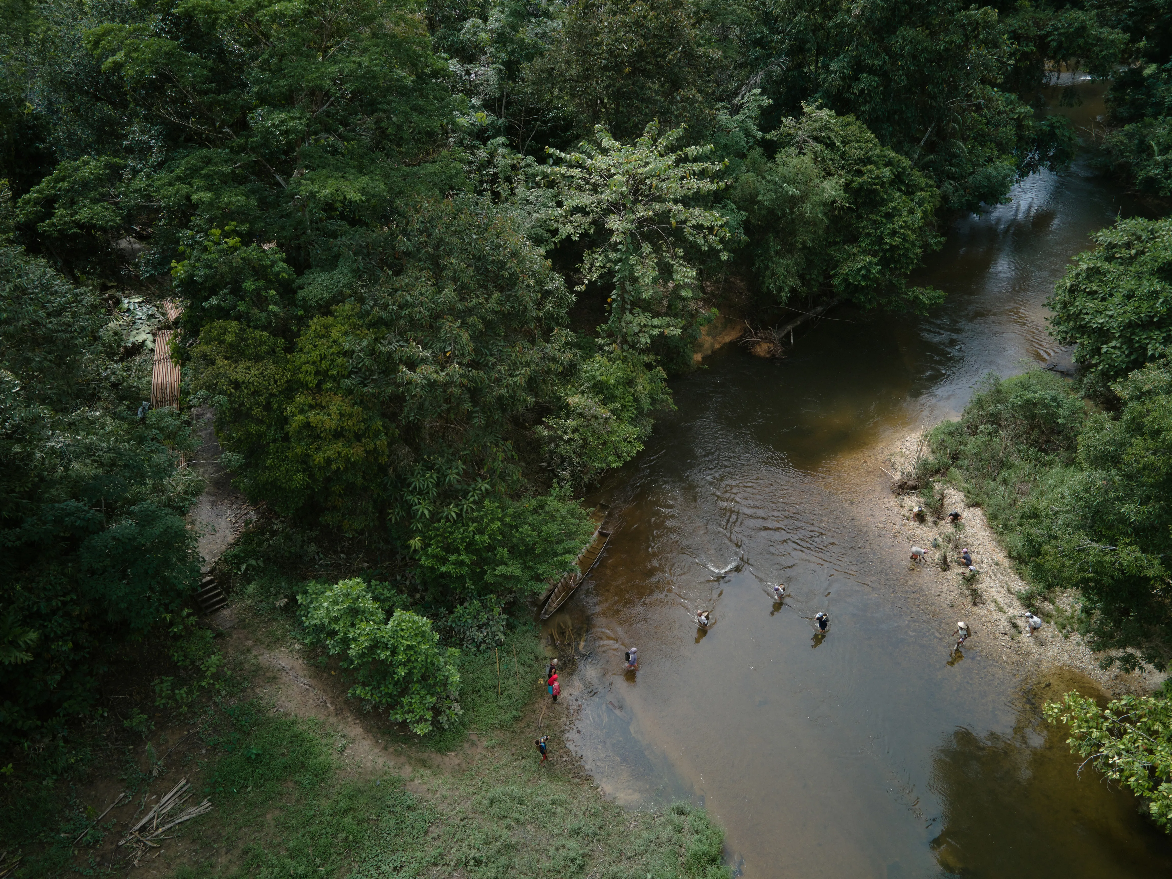 Aerial view of river with indigenous community